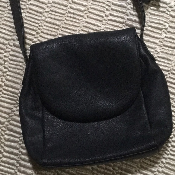 Black leather purse. Four separate pockets. Magnetic closure. 10”x11” - Picture 2 of 5